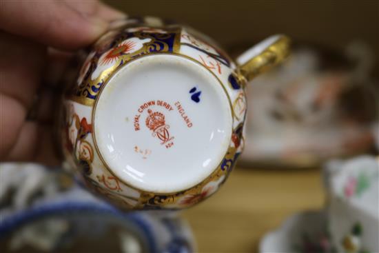 A Dresden floral encrusted cup and saucer, a quantity of Royal Crown Derby teaware and a Sitzendorf wall mirror